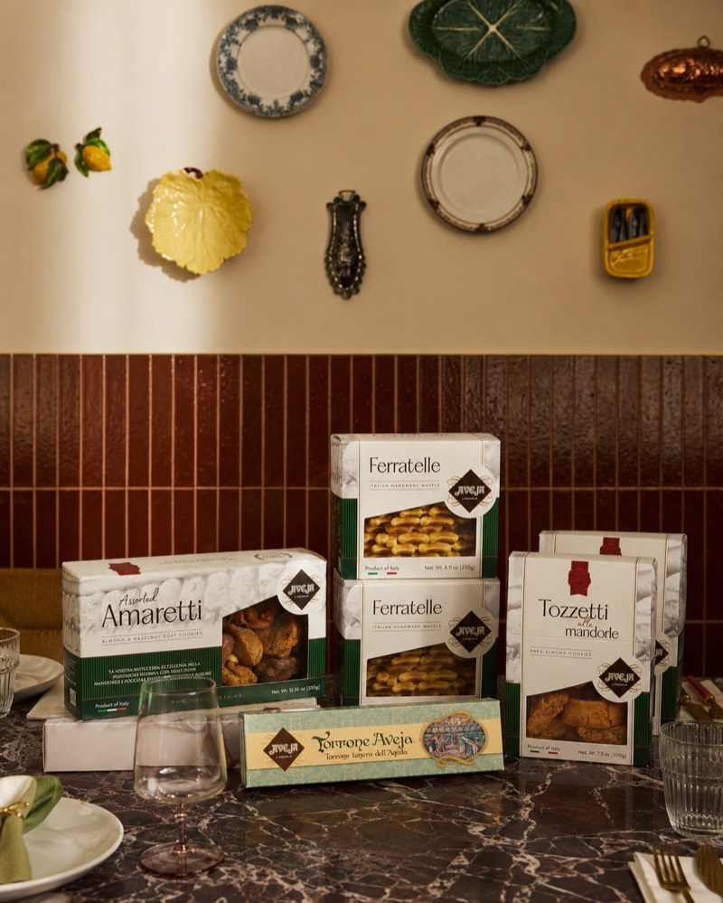 Generated scene — the range on a marble trattoria table with ceramics on the wall